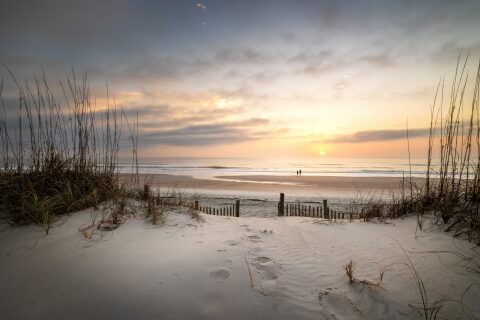 The sun rises over Amelia Island, Florida, on a quiet morning where the dunes give way to open water. It's a long way from the mountains, but it's worth the trip.